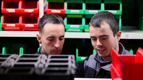 Workers taking box from shelf at storehouse Stock Footage 261617200