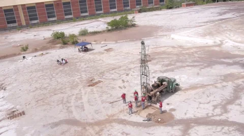 Workers taking samples from industrial waste Stock Footage 63794894