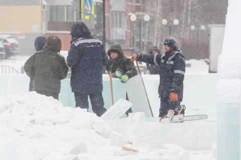 Workers talk on the construction site of the ice town 스톡 사진
