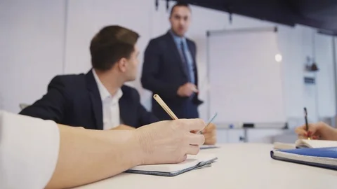 Workers talking about innovation in new startup in office Stock Footage 113648241