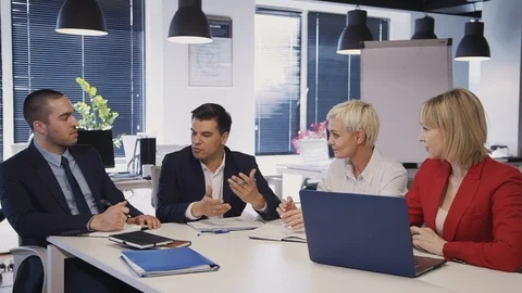 Workers talking about new startup project in office 스톡 동영상 119410598