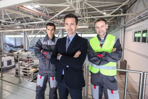 Workers team at factory Stock Photos