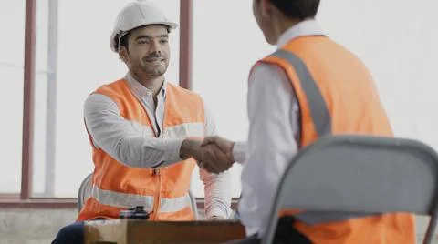 Workers team meeting planning construction. Work collaboration for success. Stock Photos