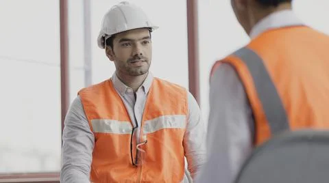 Workers team meeting planning construction. Work collaboration for success. Stock Photos