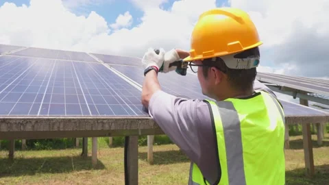 A workers technicians install heavy solar photovoltaic panels. Stock Footage 210817882