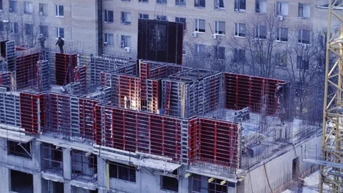 Workers on the top of the building under construction Video stock 88559631