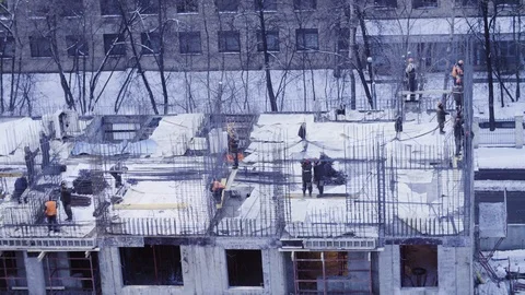 Workers on the top of the building under construction 動画素材 88562419