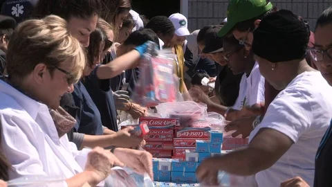 Workers in Toronto prepare emergency aid supplies for hurricane Irma survivors Stock Footage 79839544