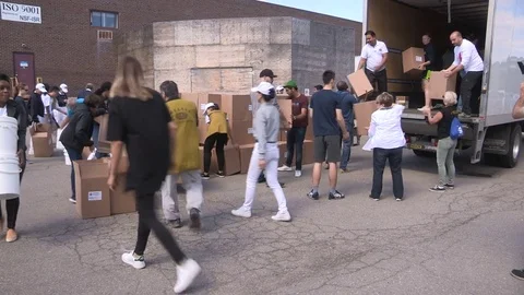 Workers in Toronto prepare emergency aid supplies for hurricane Irma survivors Stock Footage 79846087
