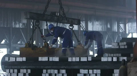 Workers transfer finished steel blocks at the factory Stock Footage 47890622