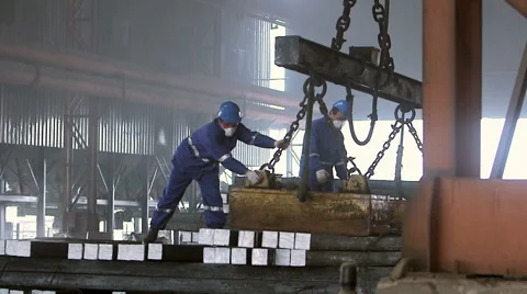 Workers transfer steel blocks Stock Footage 47890829