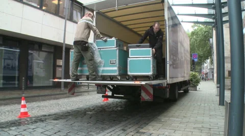 Workers transporting case boxes out of a truck Stock Footage 60836689