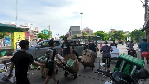 Workers Transporting Fresh Vegetables at a Busy Bangkok Market Stock Footage 340244065