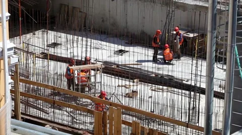 Workers in uniform at the construction site Stock Footage 52222370