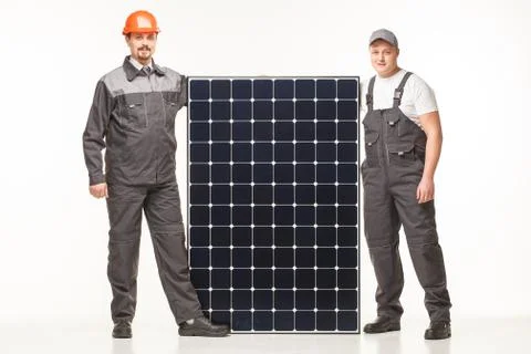 Workers in uniform with solar panels Stock Photos