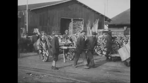 Workers unload and sort various kinds of supplies on docks - 1918 Stock Footage 98950465