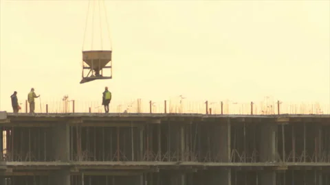 Workers unload concrete tank Stock Footage 155352751