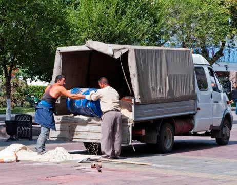 Workers unload a lorry Stock Photos
