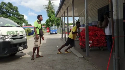 Workers Unloading Bags of Produce at Andersons Supermarket in Kokopo, Papua New  Stock Footage 136160174