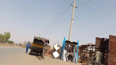 Workers Unloading Steel Sections Roadside Stall Kano Nigeria 動画素材 329676329
