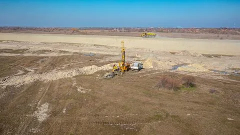 Workers use construction machine as drilling a well Stock Photos