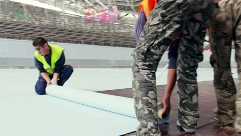 Workers use special coating to cover floor for pool Stock Footage 231719103