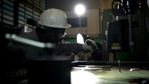 Workers use spotlights to illuminate the flowing oil Video stock 339209771