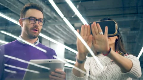 Workers use VR devices while working with engineering equipment. Stock Footage 103799211
