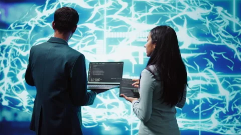 Workers using artificial intelligence deep learning to look at data Stock Footage 278699471