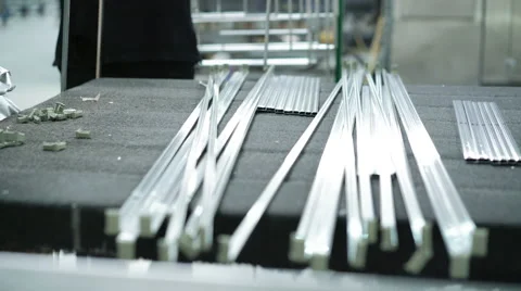 Workers using a lathe to cut window aluminum frames. 4K Stock Footage 62717878