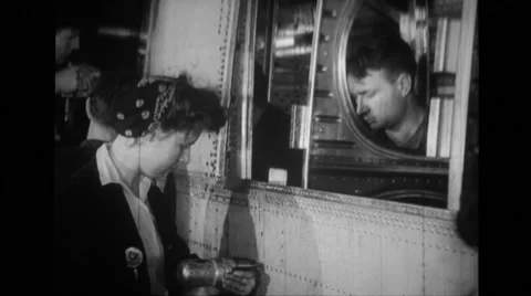 Workers using rivet gun at Willow run airplane plant Stock Footage