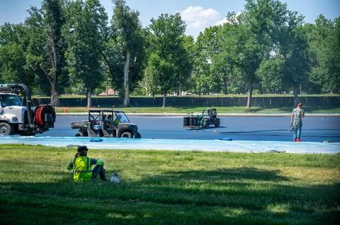 Workers, vehicles, forklifts on drained Reflecting Pool Washington DC Stock Photos