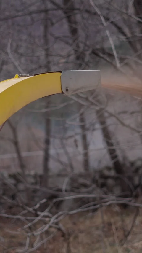 Workers walk past a machine that ejects something Stock Footage 272479706