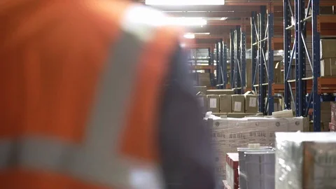 Workers Walk Through a Warehouse Video stock 123019959