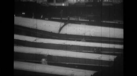 Workers walking across wing section and some workers working on engine section Stock Footage