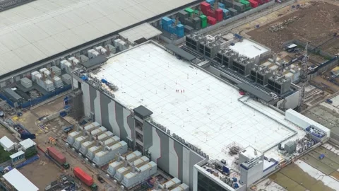 Workers walking on data center roof at digital infrastructure construction site Stock Footage 327460112