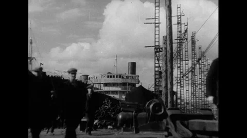 Workers walking on ship and getting ready to work, United Kingdom, 1945 Stock Footage 133386780