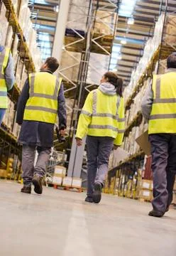 Workers walking in warehouse Stock Photos