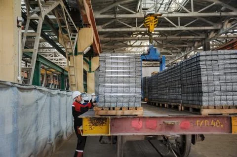 Workers in warehouse controlling transportation Stock Photos