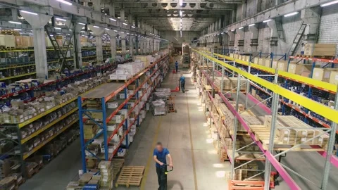 Workers in the warehouse. Workers with hydraulic forklifts in stock. Span over Vidéo 157290649