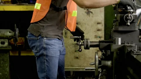 Workers wearing safety gear using a grinding machine steel in factory. Stock Footage 231103778