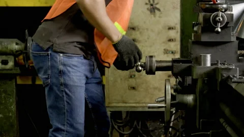 Workers wearing safety gear using a grinding machine steel in factory. Stock Footage 231104555