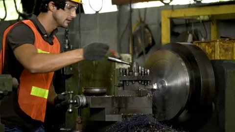 Workers wearing safety gear using a grinding machine steel in factory. Stock Footage 231108140