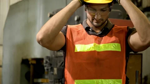 Workers wearing safety gear using a grinding machine steel in factory. Stock Footage 231108555