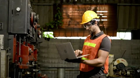 Workers wearing safety gear using a grinding machine steel in factory. Stock Footage 231110347