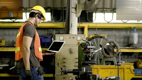 Workers wearing safety gear using a grinding machine steel in factory. Stock Footage 231110407