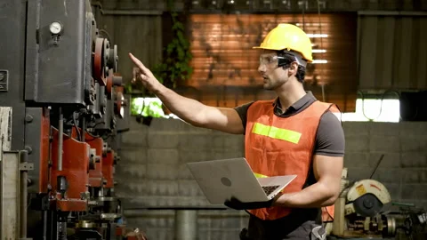 Workers wearing safety gear using a grinding machine steel in factory. Stock Footage 231110561
