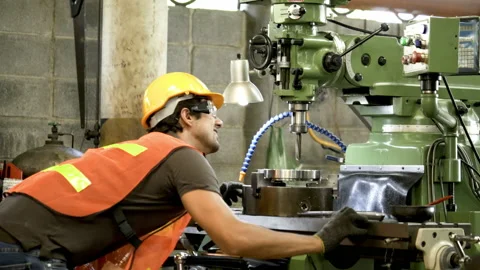 Workers wearing safety gear using a grinding machine steel in factory. Stock Footage 231110700