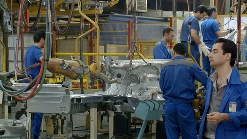 Workers weld auto parts inside Khodro car factory, Tehran, Iran Stock Footage 119162822