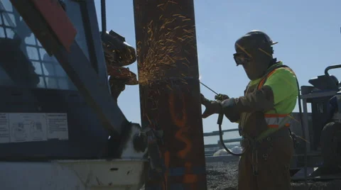 Workers welding foundation pile Stock Footage 65051618